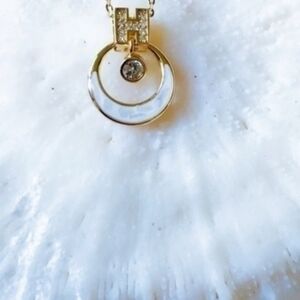 Elegant Gold and Silver Pendant Necklace